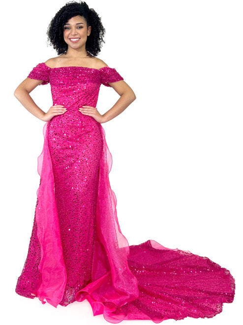 This Marc Defang 8228 dress is an elegant, fitted off-the-shoulder design, featuring a detachable overskirt and ornate pearl, sequin, and beaded detailing. It's perfect for a unique prom, pageant, or wedding look. Corset back  Sizes: 00-16  Colors: Hot Pink, White  *Allow 30 days production