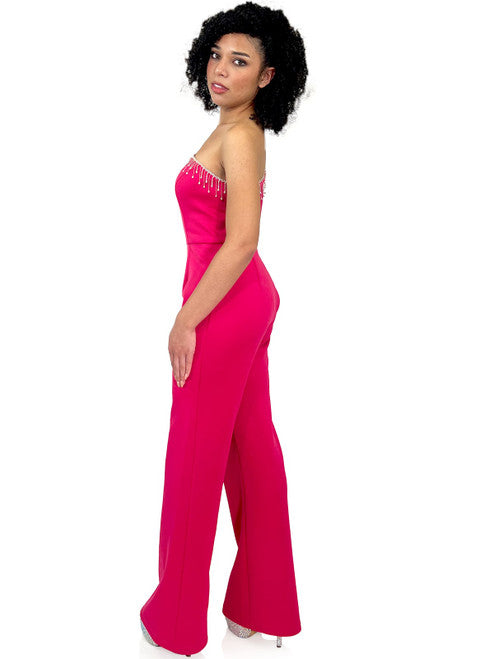 Enhance your evening look with Marc Defang's 8267 Pageant Jumpsuit. This elegant design features a one-shoulder neckline, One long bell sleeves, a crystal fringe detail and a fitted silhouette. Update your wardrobe with this fashionable and flattering piece.  Sizes: 00-16  Colors: Hot Pink, Royal Blue, Neon Green, Light Blue, Black  Contact us for custom colors - Allow 30 days Production