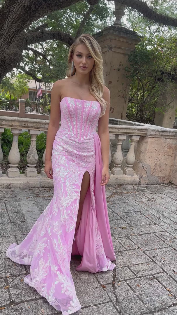 Elevate your formal attire with the Ava Presley 28291 Long Prom Dress. This strapless gown features a flattering corset design, charming side drape, and elegant train. Made with luxurious charmeuse fabric, it exudes sophistication and grace. Perfect for pageants, proms, or any special occasion.