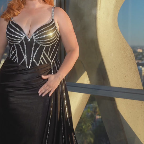 Be the belle of the ball in the Ladivine CDS440 Prom Dress. This stunning gown features a sheer crystal corset, adding a touch of glamour to your look. The satin fabric and overskirt add elegance, while the plus size fit ensures a flattering silhouette. Perfect for any special occasion. 