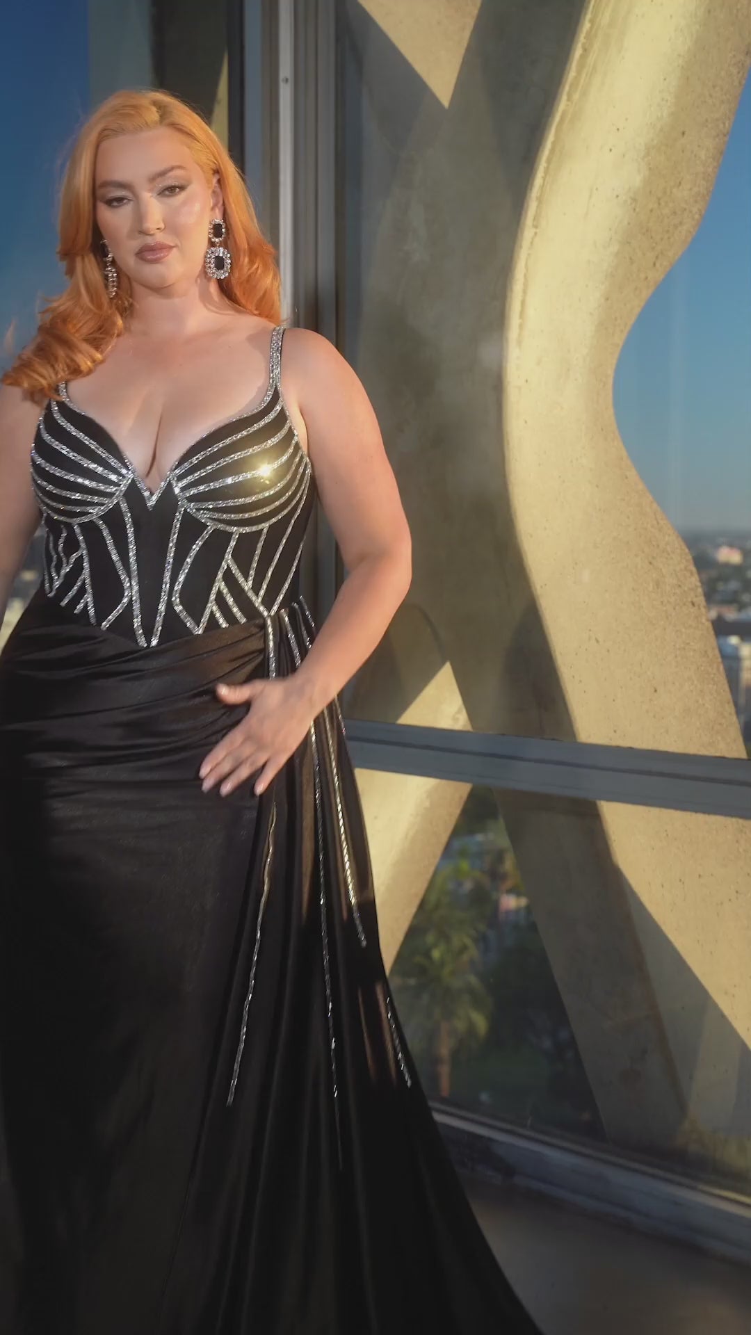 Be the belle of the ball in the Ladivine CDS440 Prom Dress. This stunning gown features a sheer crystal corset, adding a touch of glamour to your look. The satin fabric and overskirt add elegance, while the plus size fit ensures a flattering silhouette. Perfect for any special occasion. 