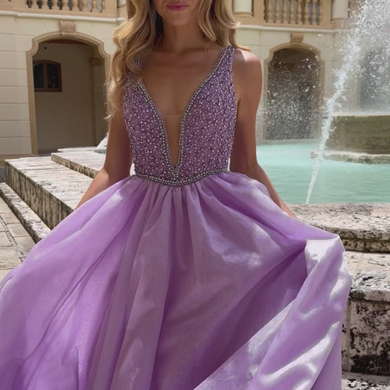 The Ava Presley 38342 A Line Beaded V Neck Ballgown is the perfect choice for your next pageant, prom, or formal event. With stunning beaded detailing and a flattering A line silhouette, this gown will turn heads and make you feel like a true queen. The V neck adds an elegant touch, while the train adds a touch of drama. Make a statement with this gorgeous dress.  Sizes: 00-16  Colors: Lilac, White, Ice Blue, Periwinkle