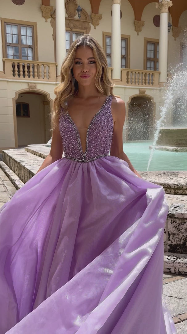 The Ava Presley 38342 A Line Beaded V Neck Ballgown is the perfect choice for your next pageant, prom, or formal event. With stunning beaded detailing and a flattering A line silhouette, this gown will turn heads and make you feel like a true queen. The V neck adds an elegant touch, while the train adds a touch of drama. Make a statement with this gorgeous dress.  Sizes: 00-16  Colors: Lilac, White, Ice Blue, Periwinkle