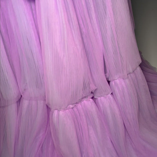 Turn heads at prom or pageants with the Ashley Lauren 11619 Long Prom Dress. This stunning two-tone tiered tulle ball gown features a sleek left leg slit, adding a touch of elegance to your look. Expertly crafted with top-quality materials, this dress is perfect for making a statement and feeling confident. Tiered dreams! This two-tone tired tulle ball gown features a one shoulder design and a left leg slit.