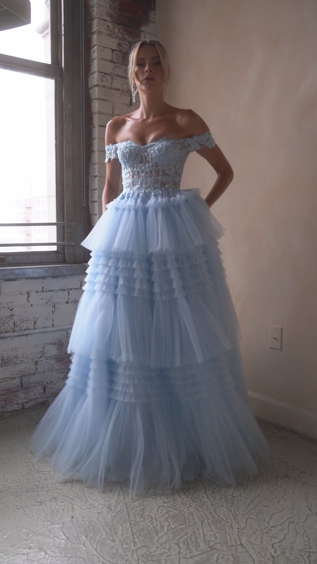 Indulge in the opulence of Ladivine's 9315 Long Layered Tulle Ballgown. The stunning sheer lace corset and off-the-shoulder design exude elegance, while the layered tulle adds volume and movement. Perfect for prom or any formal event, this dress will make you feel like a princess. Let your fairytale dreams come true with this exquisite layered pleated tulle ball gown!