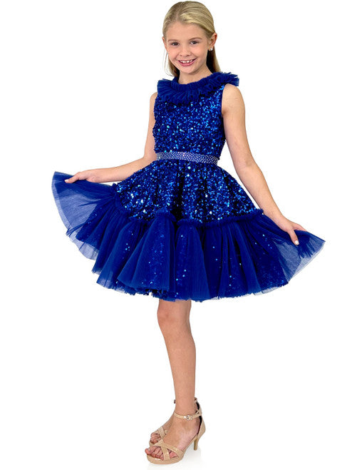 Marc Defang Kids 5111 Dress is a stunning cocktail dress for special occasions. Crafted from sequin tulle with pleated ruffle and layered detailing, it is sure to turn heads. Perfect for pageants, it will make your little one feel like a princess. Please inquire for additional colors.  Sizes: 4,5,6,7,8,9,10,11,12,13,14  Colors: Lilac, Mint, Royal Blue