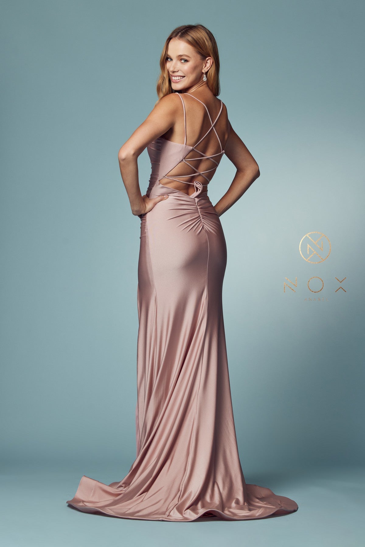 Nox Anabel T481 Long Fitted Jersey Prom Dress Backless Corset Slit Formal Gown Train Sleek and chic with a lightweight feel, this gorgeous scoop neck with spaghetti straps fitted gown by NOX ANNABEL is as cool as it is comfortable. Available Colors: Dusty Rose, Fuchsia, Lavender, Neon Orange, Black, Red, Sunflower, Iris