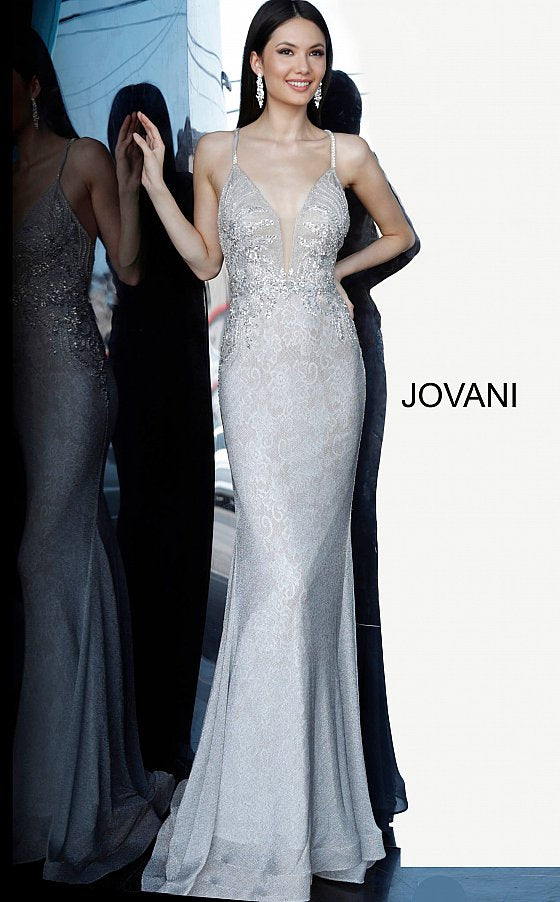 Jovani 03167 is a 2021 Prom Dress, Pageant Gown & Formal Evening Wear.  Details: Silver lace dress, fully lined, form fitting silhouette, floor length, embellished Spaghetti strap bodice, plunging neckline with mesh insert for support, open back with embellished criss cross straps. Available Sizes: 00,0,2,4,6,8,10,12,14,16,18,20,22,24 Available Colors: Silver