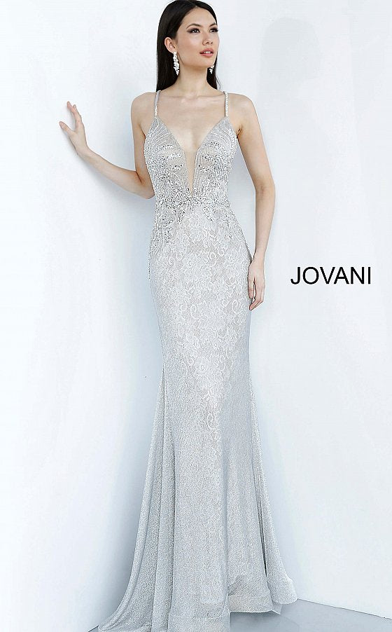 Jovani 03167 is a 2021 Prom Dress, Pageant Gown & Formal Evening Wear.  Details: Silver lace dress, fully lined, form fitting silhouette, floor length, embellished Spaghetti strap bodice, plunging neckline with mesh insert for support, open back with embellished criss cross straps. Available Sizes: 00,0,2,4,6,8,10,12,14,16,18,20,22,24 Available Colors: Silver