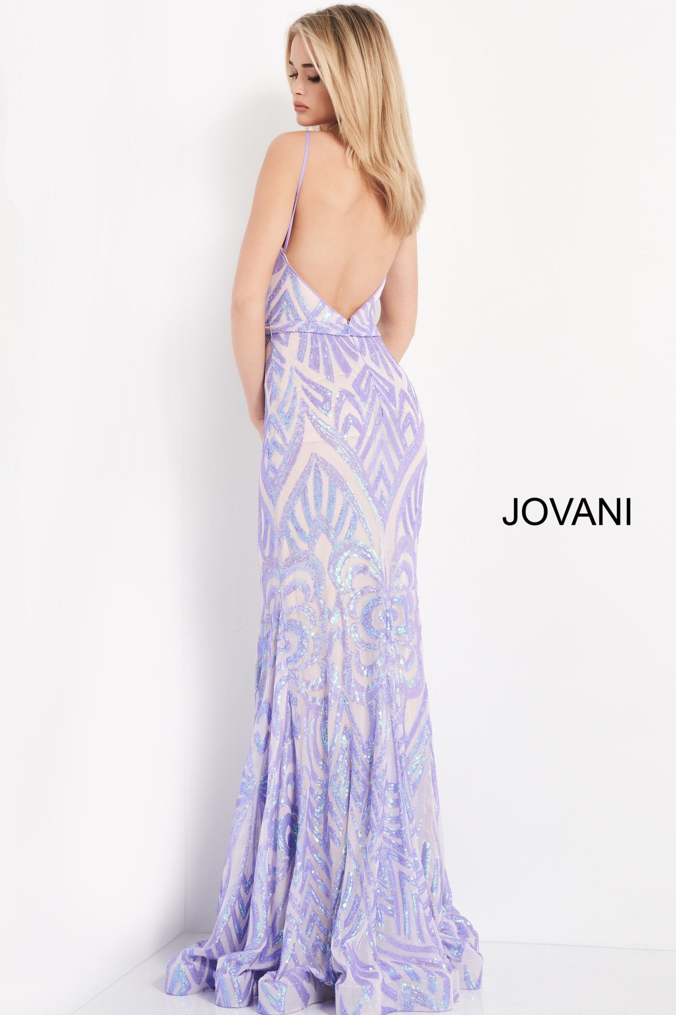 Jovani 03446 This is a long fit and flare prom dress with a high neckline and backless design.  It has a beaded sequins pattern throughout.  Lilac  Size 12