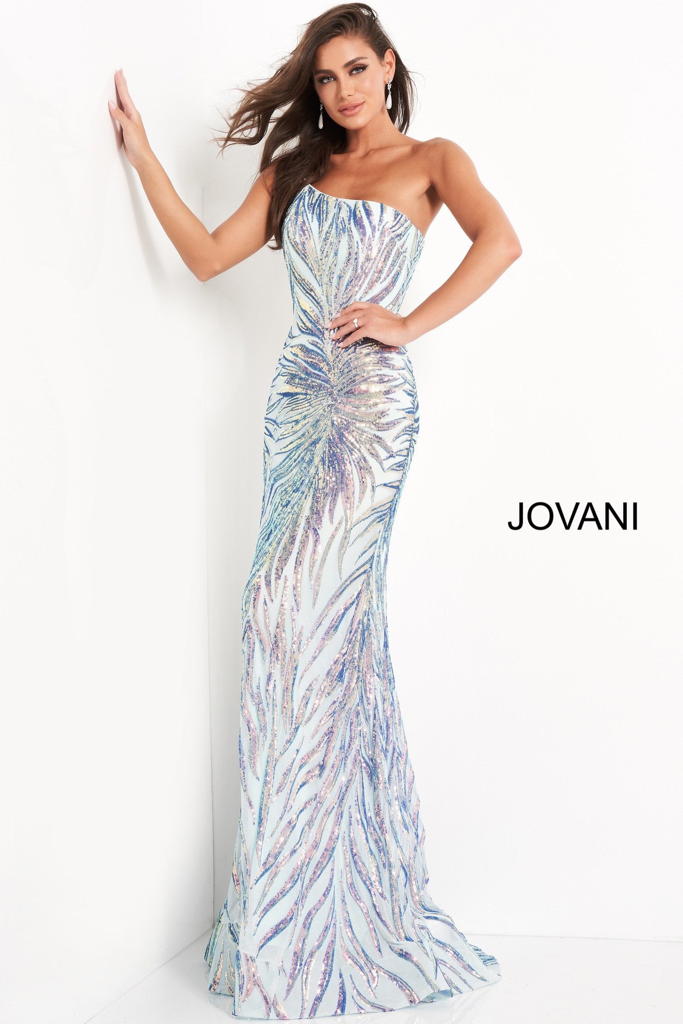 Jovani 05664 is a long fitted formal evening gown. This one shoulder Prom Dress has a Fit & Flare silhouette. Featuring Embellished Sequin Asymmetrical  Starburst patterns that accentuate any figure! Lush sweeping train is perfect for Pageant Presence on stage!  Available Sizes: 00,0,2,4,6,8,10,12,14,16,18,20,22,24  Available Colors: Mint/Multi