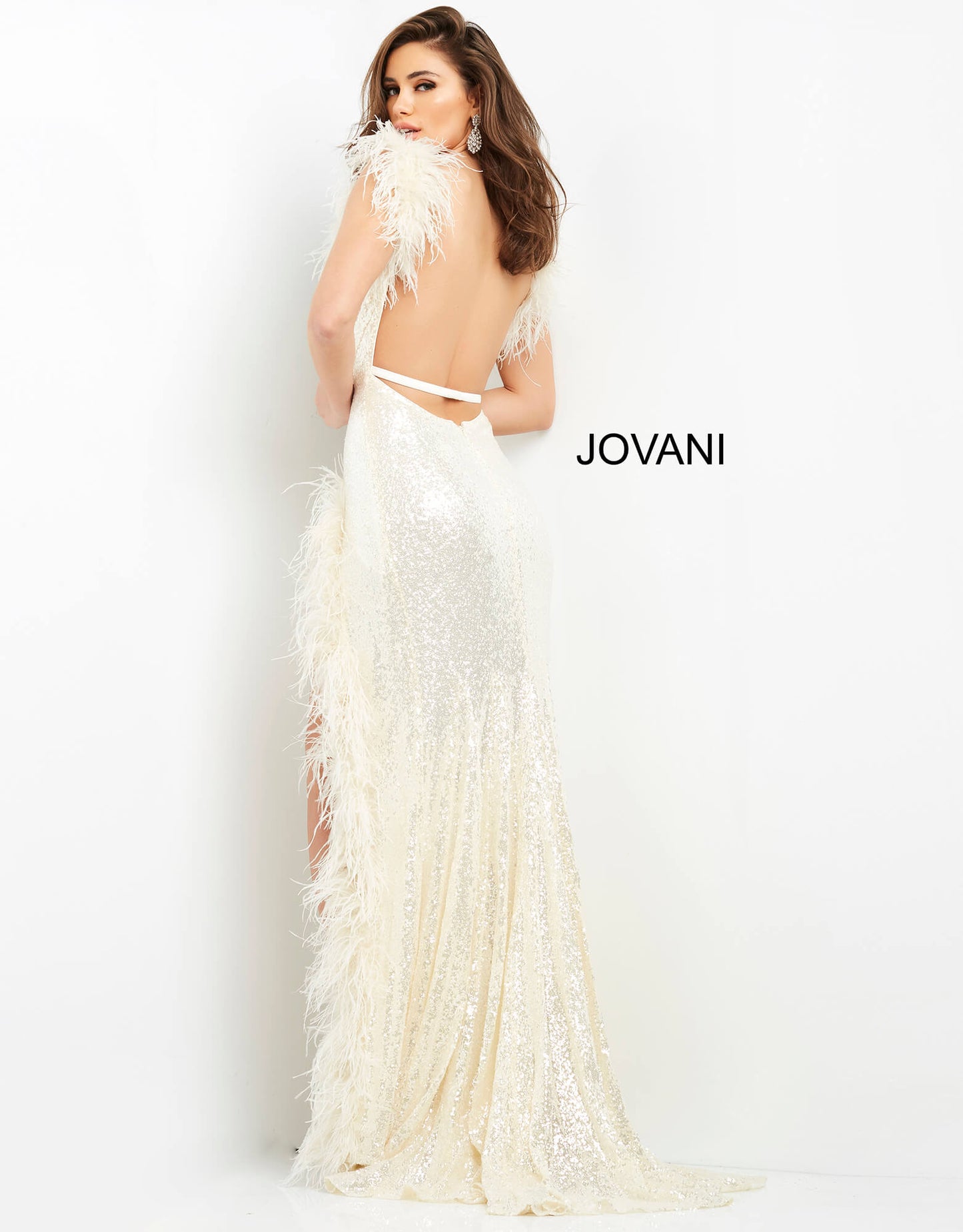 Jovani 06164 This extravagant Prom, Pageant and Evening Gown has a Plunging neckline with feather details on the straps and surrounding the high thigh side slit.  The long prom dress has sequins throughout and has a sexy open back.   Colors  Cream, Lilac  Sizes  00-24