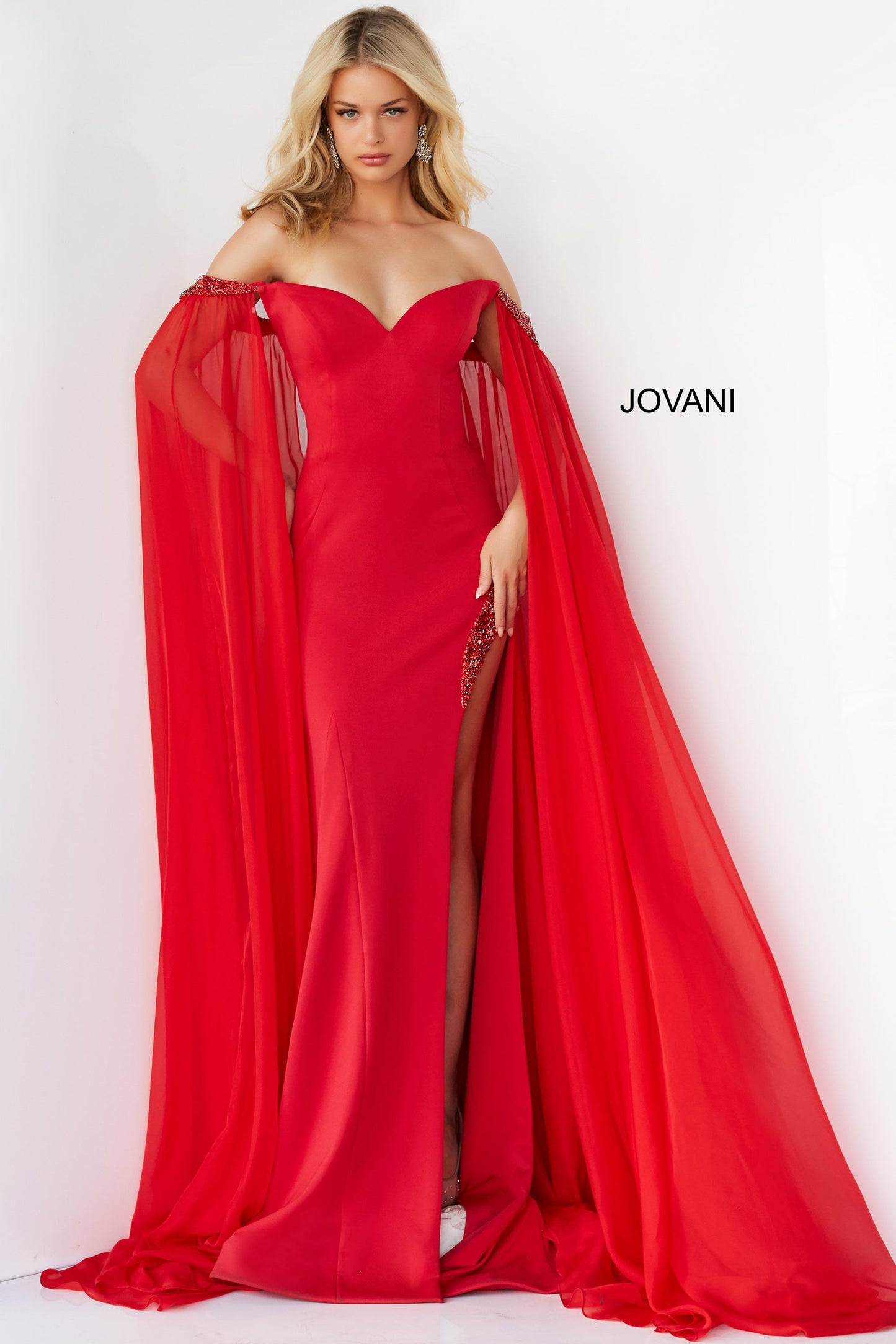 Jovani 07652 Prom Dress Cape Sleeves Pageant Gown.  This is a strapless prom dress with flattering fitted silhouette with an off-the-shoulder sweetheart neckline. It has  beaded chiffon around the arms with long sheer sweeping chiffon Cape Sleeves.  Excellent choice for Pageants.