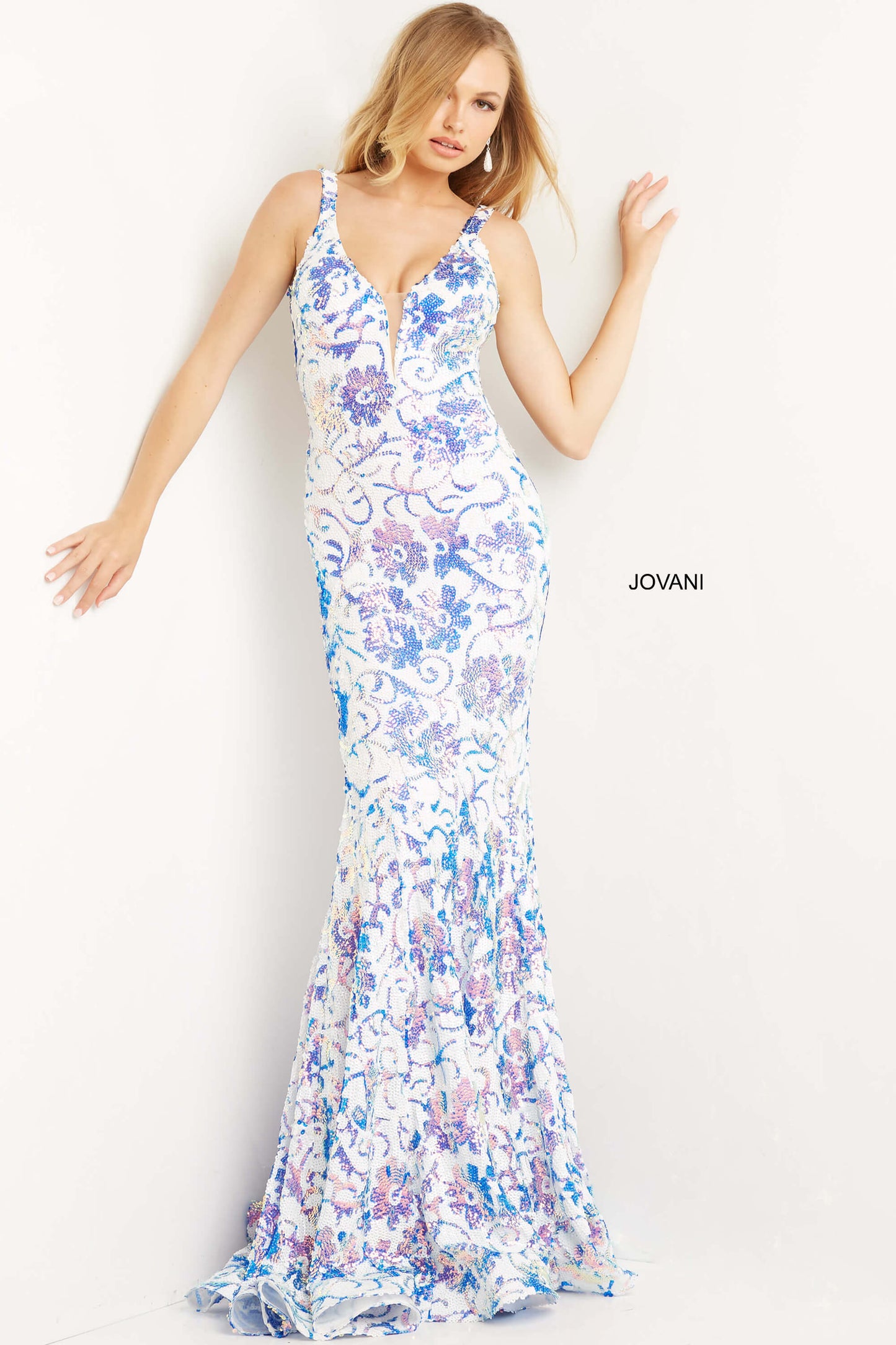 Jovani 08527 is a stunning formal prom & pageant dress. Featuring a floral design in sequin accents. Plunging V neckline. Lush sweeping train & Open midrise back. Great Gown for any formal event! This gown reveals a mermaid silhouette lavishly studded with floral sequin embellishment throughout finished with a sweep train.   Available Sizes: 00,0,2,4,6,8,10,12,14,16,18,20,22,24  Available Colors:  IVORY/BLUE, IVORY/EMERALD, IVORY/HOT-PINK, IVORY/LIGHT ORANGE, IVORY/PURPLE, WHITE/AB