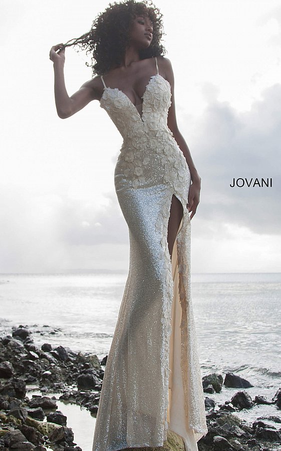 Jovani 1012 is a Delicate all over sequin Embellished Prom Dress with Floral Appliques. Features a plunging neckline & Slit in the skirt. Small Train in Back.   Details: Sequin fabric, floral appliques, fitted silhouette, high slit skirt with sweeping train, sleeveless bodice, plunging neckline with sheer mesh insert, low back with strap across for support, spaghetti straps over shoulders.