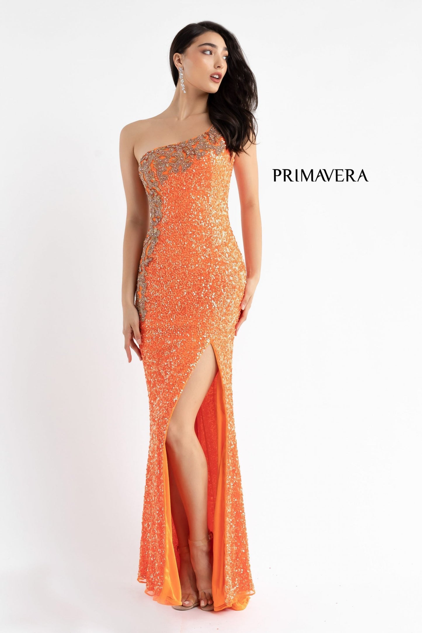 Primavera Couture 3637 is a stunning Long Fitted Sequin Embellished Formal Evening Gown. This One Shoulder Prom Dress Features Beaded Embellishments cascading from the one shoulder neckline down the side of the gown along the hip. Slit in skirt with a sweeping train. Great Pageant Formal Style.