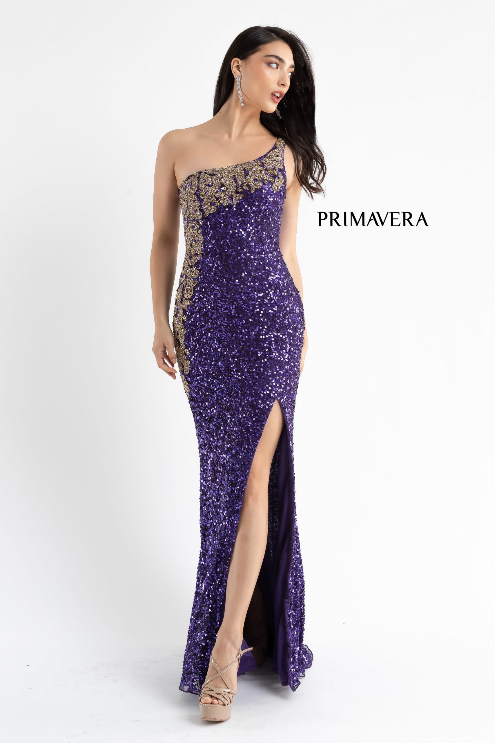 Primavera Couture 3637 is a stunning Long Fitted Sequin Embellished Formal Evening Gown. This One Shoulder Prom Dress Features Beaded Embellishments cascading from the one shoulder neckline down the side of the gown along the hip. Slit in skirt with a sweeping train. Great Pageant Formal Style.