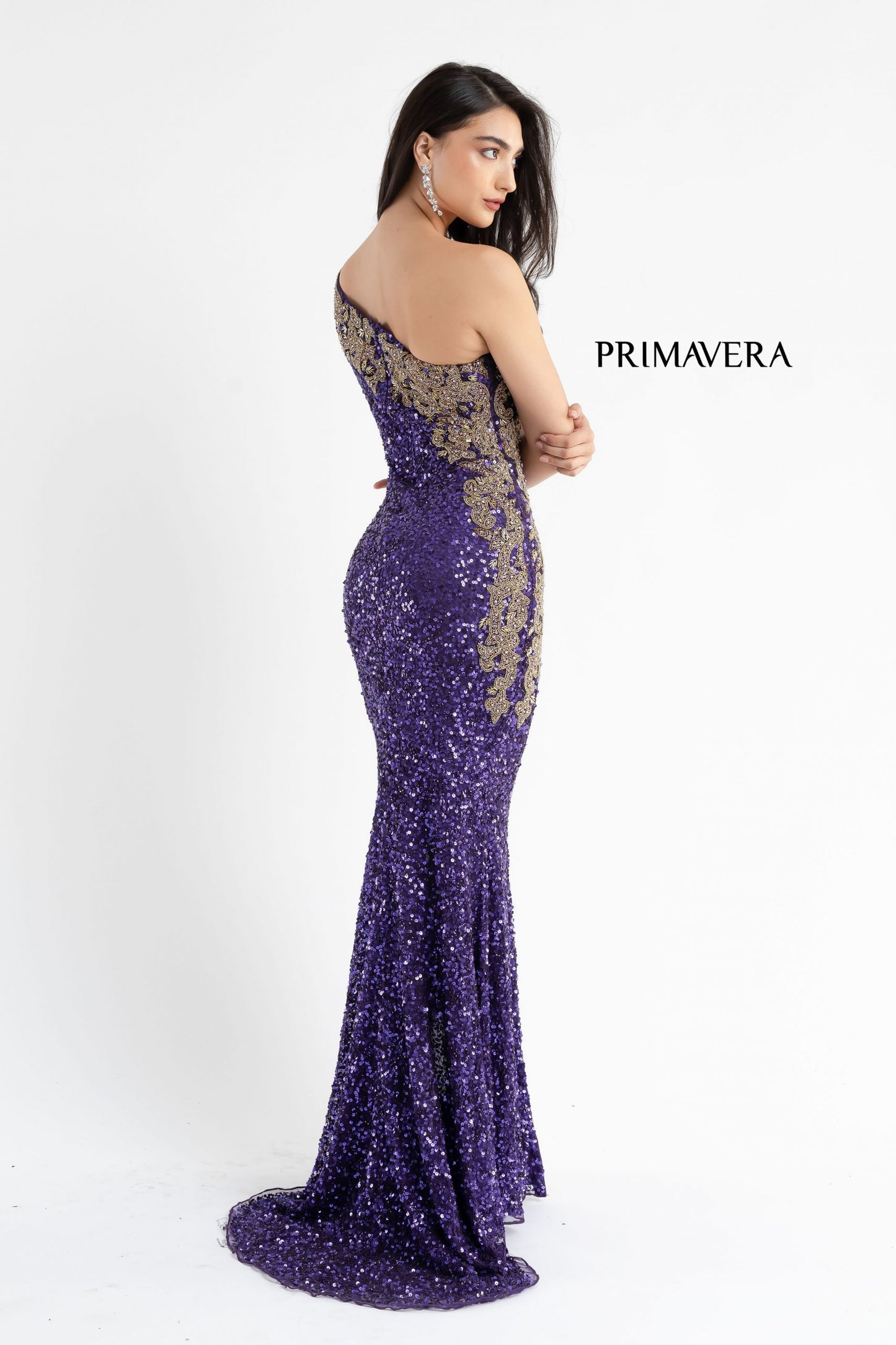 Primavera Couture 3637 is a stunning Long Fitted Sequin Embellished Formal Evening Gown. This One Shoulder Prom Dress Features Beaded Embellishments cascading from the one shoulder neckline down the side of the gown along the hip. Slit in skirt with a sweeping train. Great Pageant Formal Style.