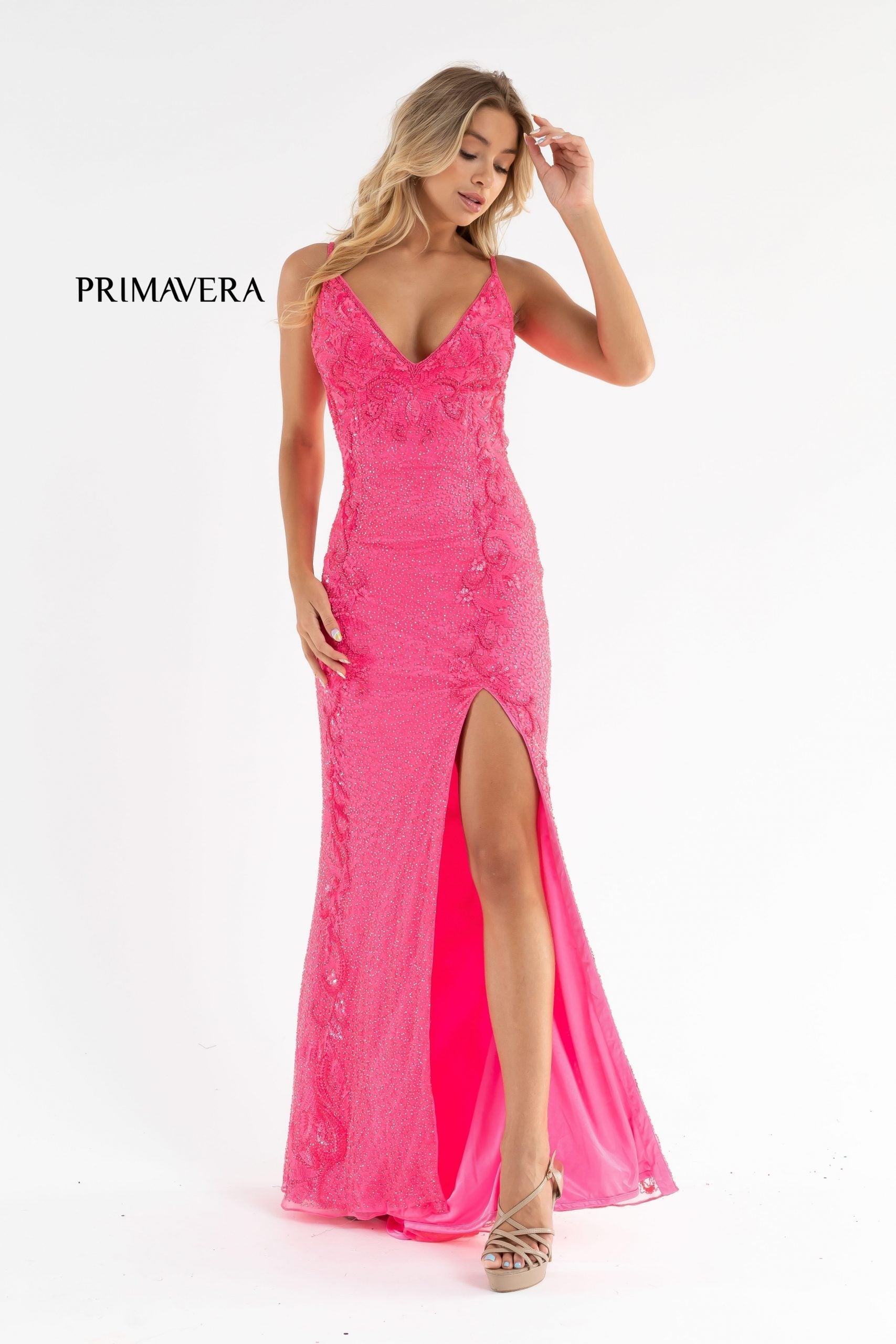 Primavera Couture 3727 This is a beautiful long beaded prom dress.  The V neckline is surrounded by gorgeous floral details that extend down the sides of the dress.  The back is a v open back and the skirt has a slit and sweeping train.  A magnificent choice for prom or formal evening dress.  Available colors:  Midnight, Black, Ivory, Mint, Red, Rose, Neon Pink,   Available sizes:  000-24