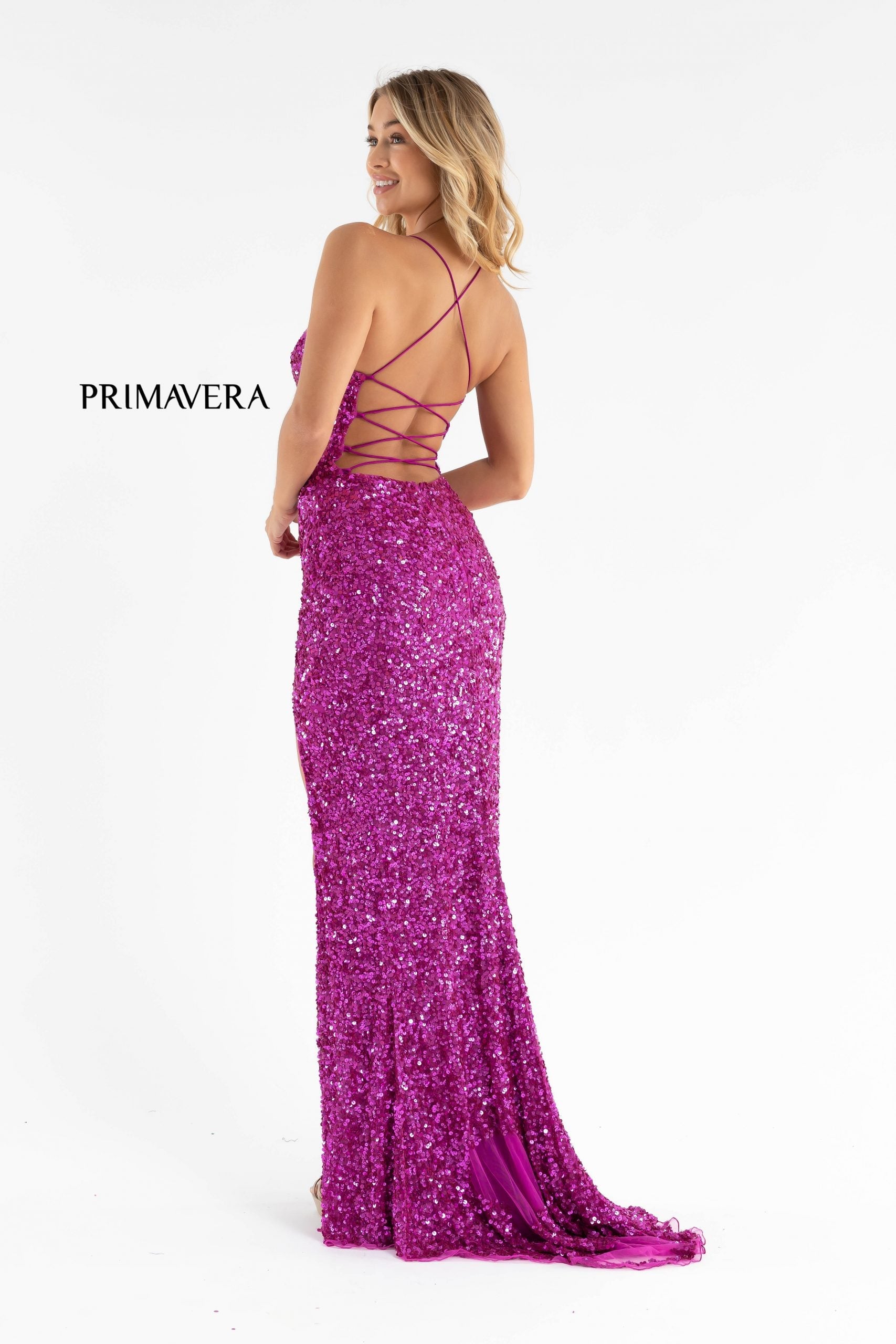 Primavera Couture 3791 Exclusive Prom Dress.  This is an all sequins prom dress with a V neckline and spaghetti straps that lace up and tie in the open back.  It has a wrap style side slit and a sweeping train.  Colors:  Fuchsia  Sizes:  4