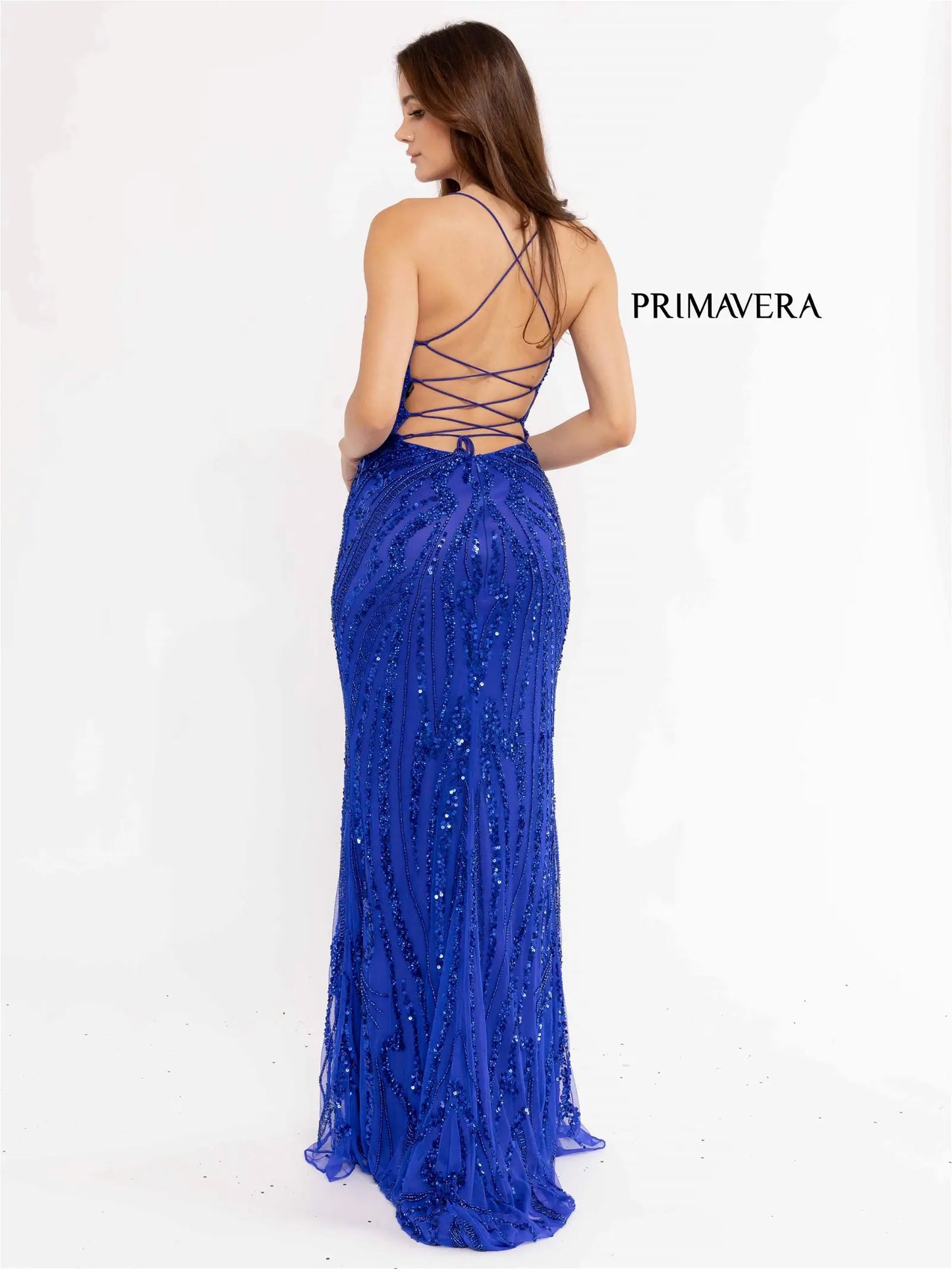 Primavera Couture 3958 Prom Dress Long beaded Gown. Its has a slit and a beautiful design on the gown.