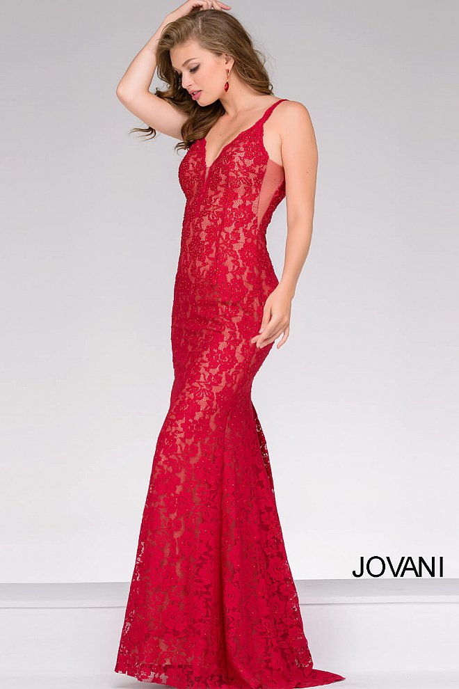 Jovani 48994 Stretch lace prom dress embellished with heat set stones, nude underlay, fitted silhouette, straps over shoulders, plunging v neckline with sheer mesh, sheer mesh inserts along the sides, sweeping train, low v back. Makes an excellent pageant gown or evening gown. 