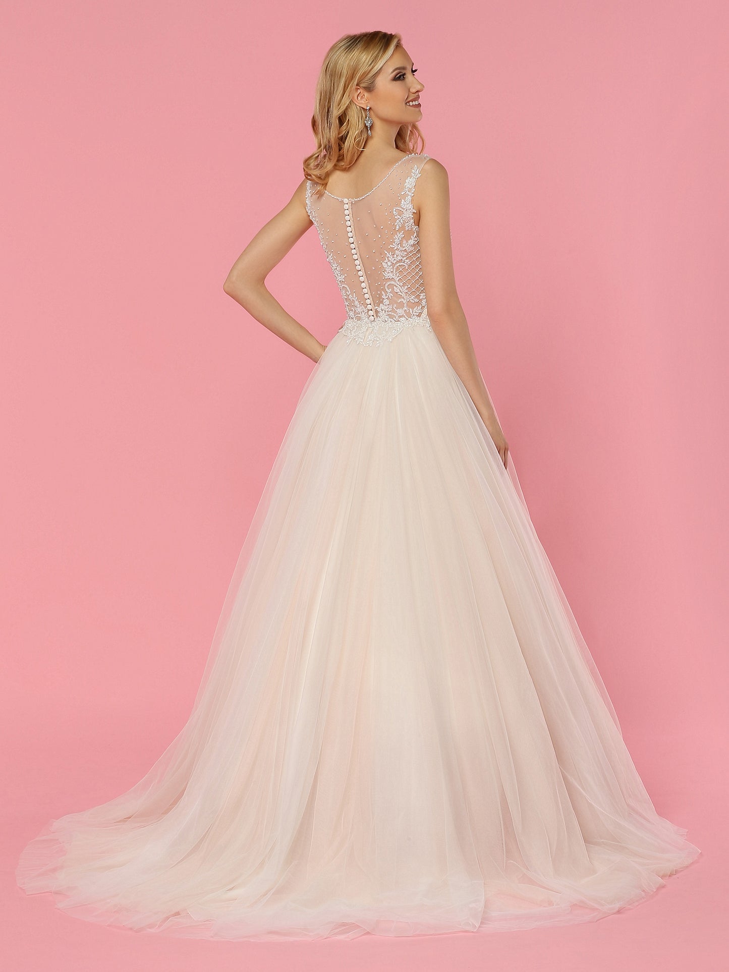 Davinci Bridal 50457 is a soft tulle ballgown wedding dress. Featuring a Crystal Embellished Bodice with a sheer mesh plunging neckline and sheer open back with Embellishments and buttons down the seam. Lace cascading from the bodice into the soft Lush Tulle skirt.  Available for 1-2 Week Delivery!!!  Available Sizes: 2,4,6,8,10,12,14,16,18,20  Available Colors: Ivory/Blush, Ivory/Ivory