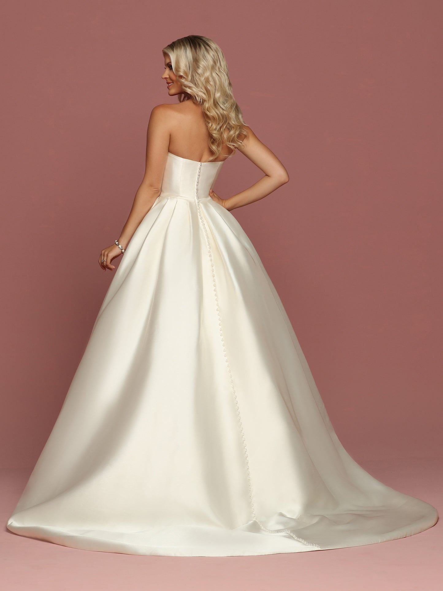 Davinci Bridal 50494 is a gorgeous Mikado Wedding Dress. Strapless Sweetheart neckline with a simple waist belt with bow. Full Pleated skirt has Pockets! Button line the entire back seam of the gown into the train.  Available for 1-2 Week Delivery!!!  Available Sizes: 2,4,6,8,10,12,14,16,18,20  Available Colors: Ivory