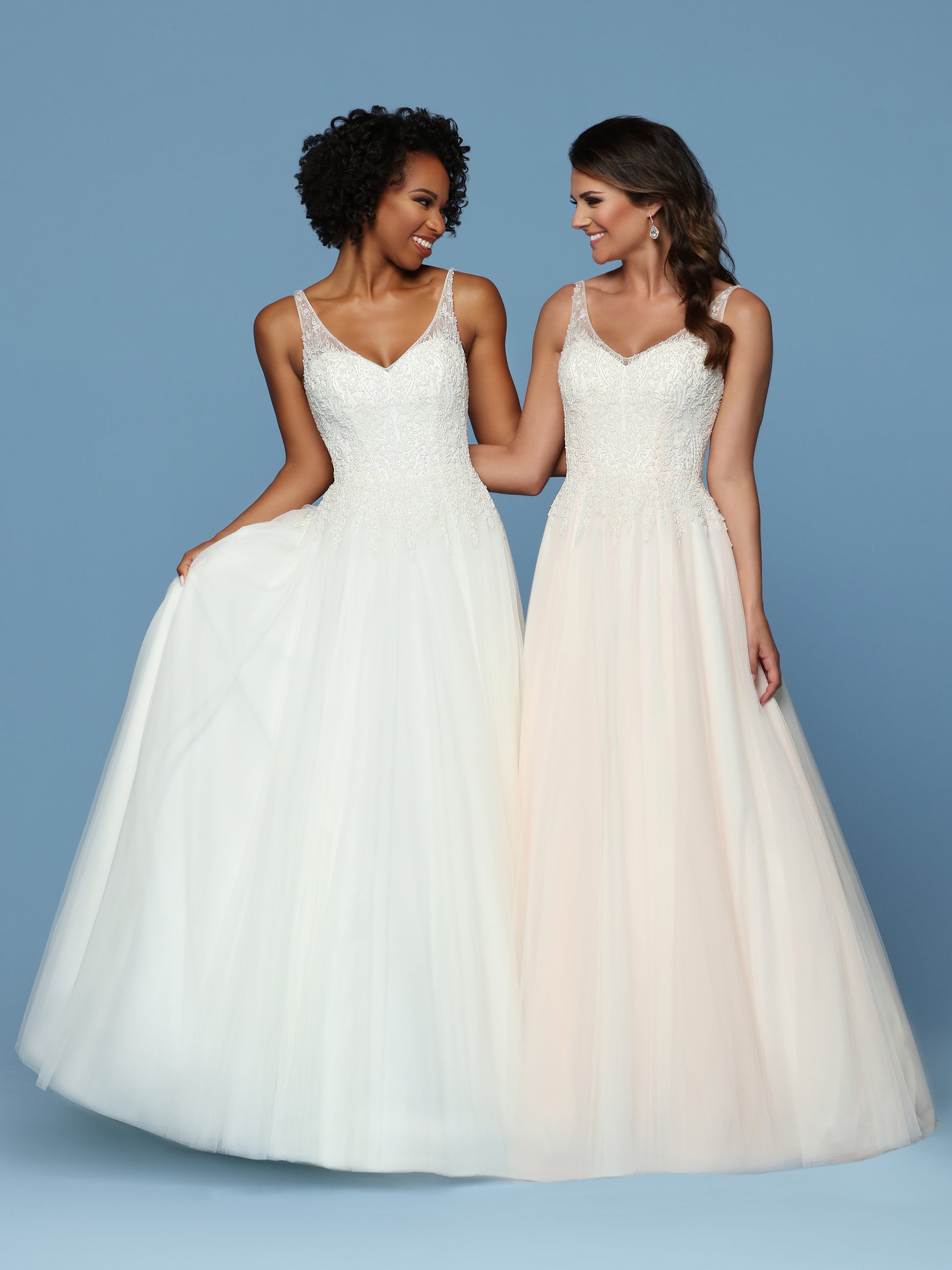 Davinci Bridal 50544 is a Beautiful Lush Soft Tulle A Line Ball Gown with a Hand Embellished Bodice cascading into to tulle skirt. Sweetheart Neckline with a sheer Illusion V Neck and straps leading around to an open V back.  Available for 1-2 Week Delivery!!!  Available Sizes: 2,4,6,8,10,12,14,16,18,20  Available Colors: Ivory/Blush, Ivory/Ivory