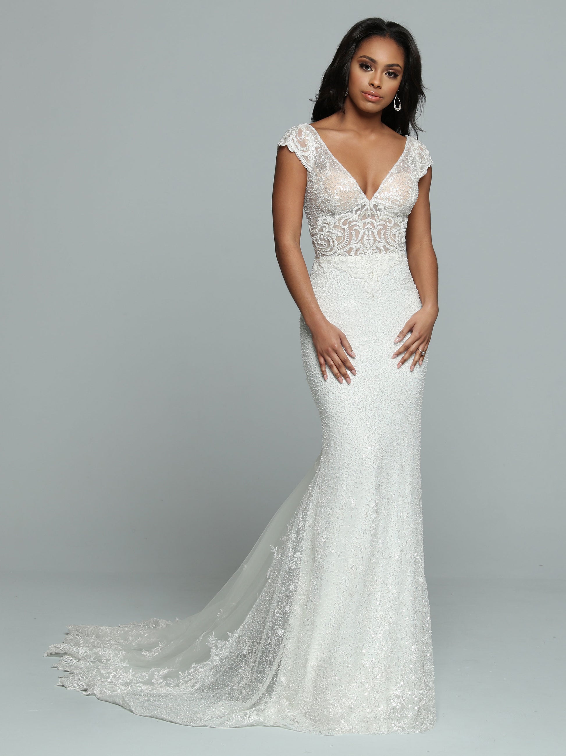 Davinci Bridal 50666 Long Sheer Sequin Mermaid Wedding Dress Lace Train Gown Sparkling Sequin Fit & Flare Sheath Wedding Dress features a Sheer Bodice with V-Neckline & Deep V-Back. Beaded Lace Applique covers the Bodice & Wide Off the Shoulder Straps. The Skirt has a Sheer Back Panel that ass Fullness to the Lace Edged Sheer Chapel Train.