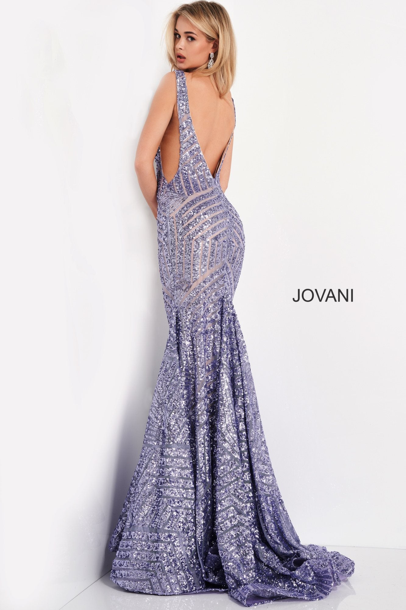 Long Jovani 59762 Prom Dress, Featuring a plunging neckline & A Fully sequined Fitted Mermaid Bodice. This Open V Back Pageant Gown & prom dress is perfect for the stage is has a lush trumpet sequin embellished skirt and sweeping train. 