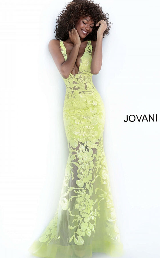 Jovani 60283 Available Colors: black, forest, fuchsia, light-blue, red, rose/gold, royal, tangerine, white, yellow Available Sizes: 00 - 24 Closure: Invisible Back Zipper with Hook and Eye Closure.   Details: Sheer mesh, sequin flower appliques, form fitting silhouette, floor length, sleeveless bodice, plunging V neck, V back, sheer mesh inserts on the sides. Long sheer embroidered and sequined deep v neck sleeveless formal gown with an open v-back by Jovani.