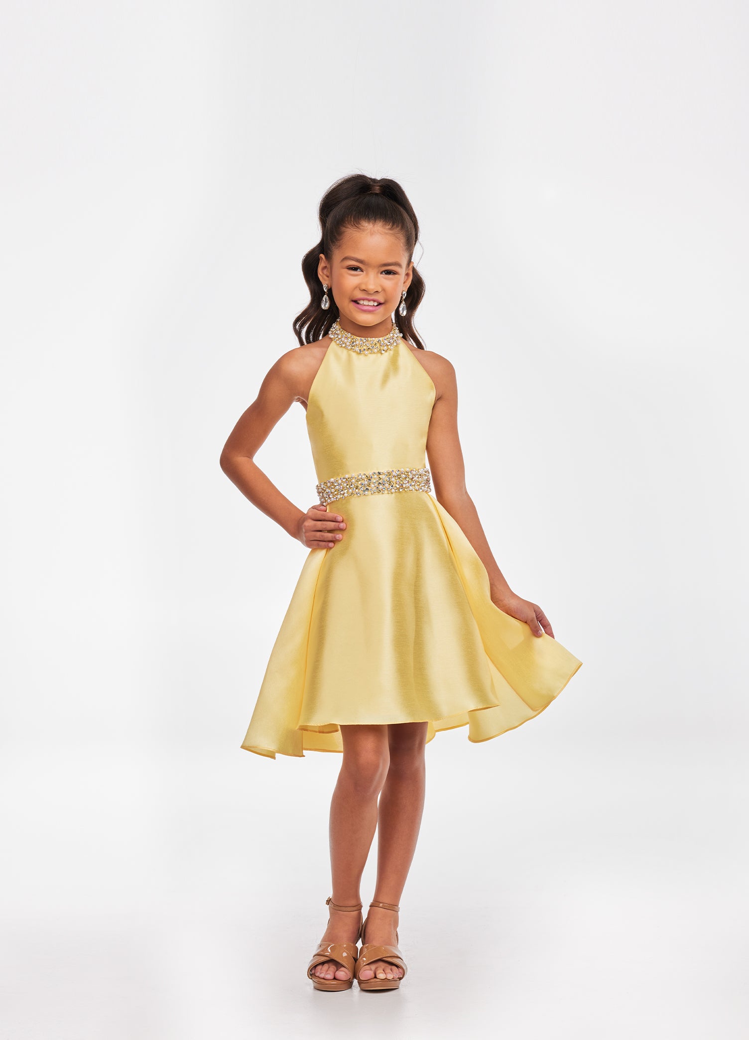 Ashley Lauren Kids 8103 Short Halter cocktail dress with overskirt Pageant Wear Stunning kids mikado cocktail dress featuring a crystal and pearl neckline and waist. The slight a-line skirt is completed with an overskirt for extra flare. Halter Neckline Crystal Beaded Neck & Belt A-Line Skirt Overlay Available Sizes: 4-16 Available Colors: Sky, White, Yellow, Orchid