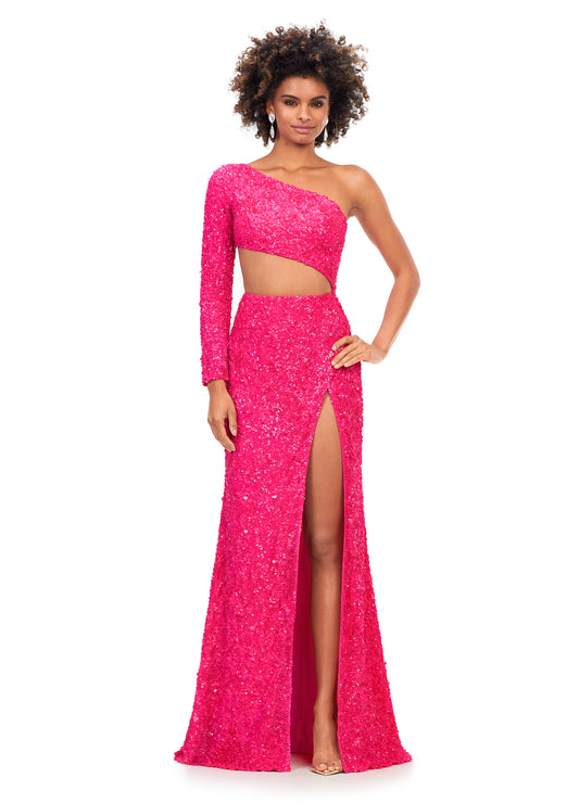 Ashley Lauren 11340 This sequin one shoulder gown features one sleeve and a shark bite cut out. The gown is complete with a left leg slit.