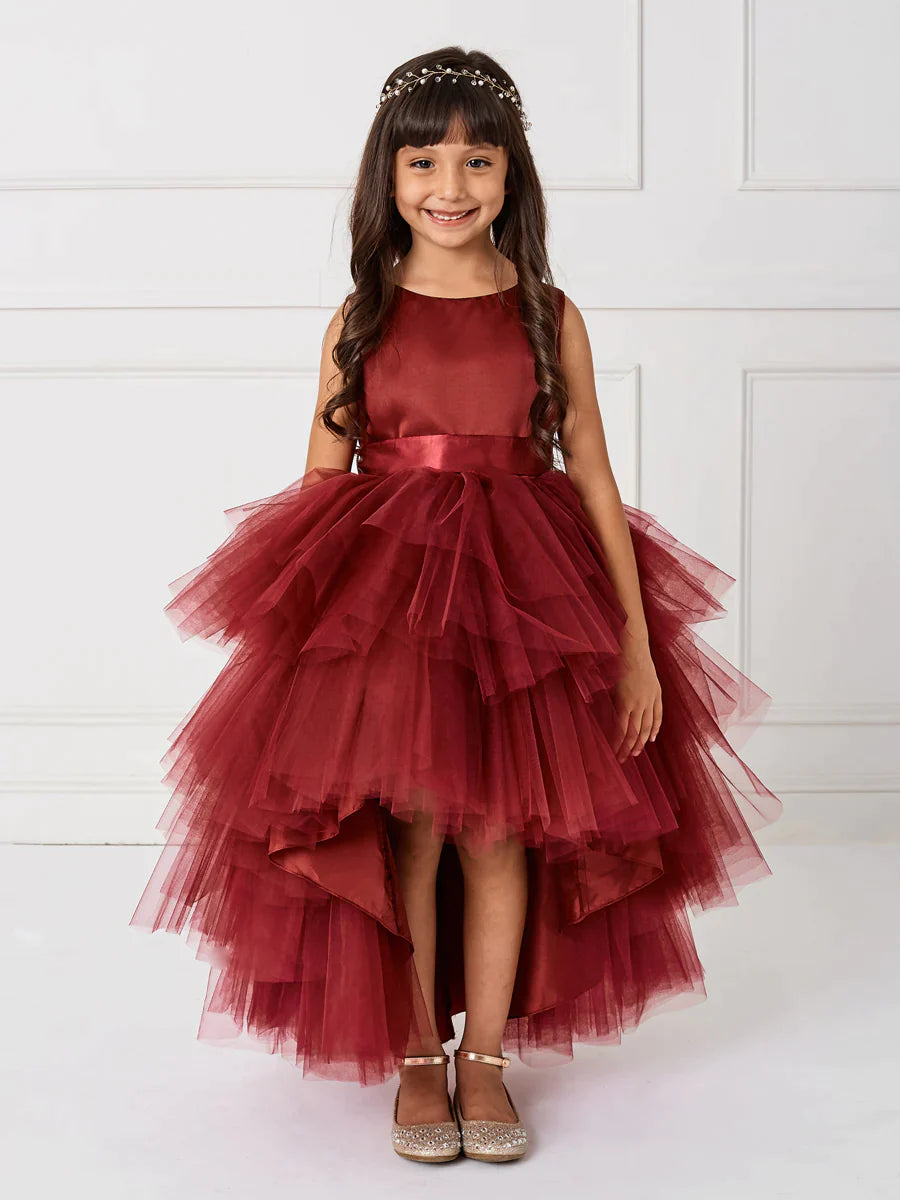 This Tip Top 5658 Girls Layered Tulle High Low Skirt Formal Dress is a perfect choice for that special day. The tulle high-low skirt, satin formal gown, and flower girl satin sash come together to create a beautiful, unique look perfect for flower girls, junior bridesmaids or formal occasions.  Sizes: 6M-16  Colors: Black, Blush, Burgundy, Eggplant, Ivory, Red, Royal Blue, White, Champagne, Lilac, Sky Blue