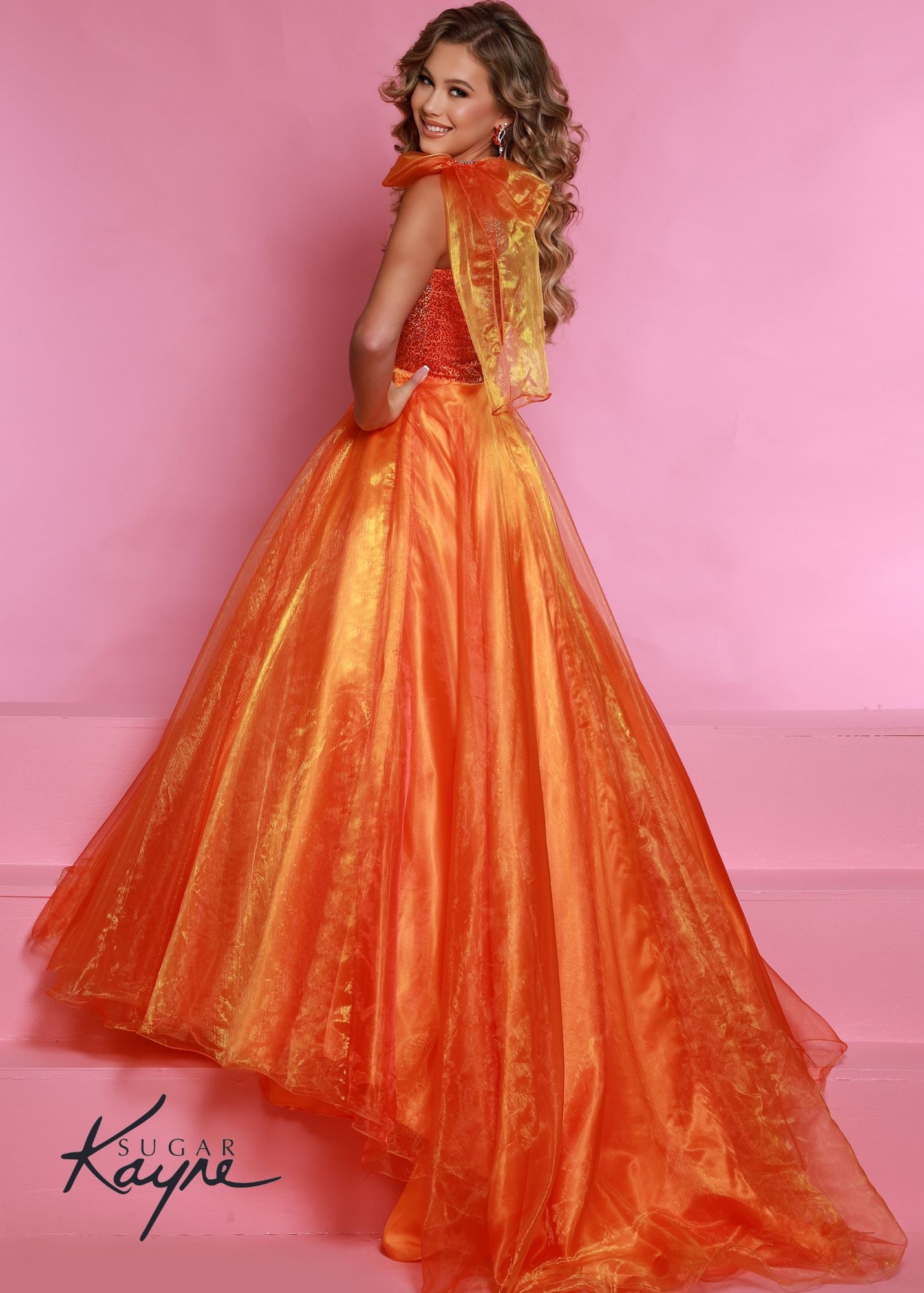 Sugar Kayne C310 Girls One Shoulder Bow A Line Shimmer Pageant Dress Crystal Gown  Go ahead and take a BOW in this lovely one-shoulder organza ballgown. The ombre beaded bodice brings all the dazzle!  Colors: Orange, Yellow, Blue  Sizes: 2, 4, 6, 8, 10, 12, 14, 16  Fabric Organza, Mesh, Satin Lining