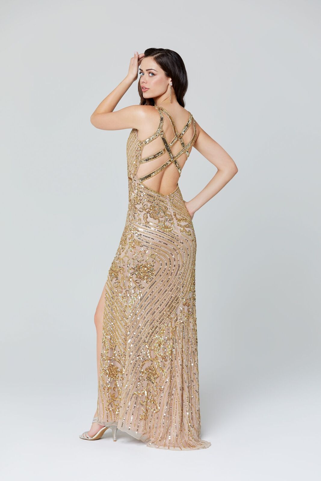 Primavera Couture 3412 v neckline sequin beaded evening gown with beaded belt waistline and side slit.  This prom dress features multiple straps that cross in the open back. Great for prom or pageant. 