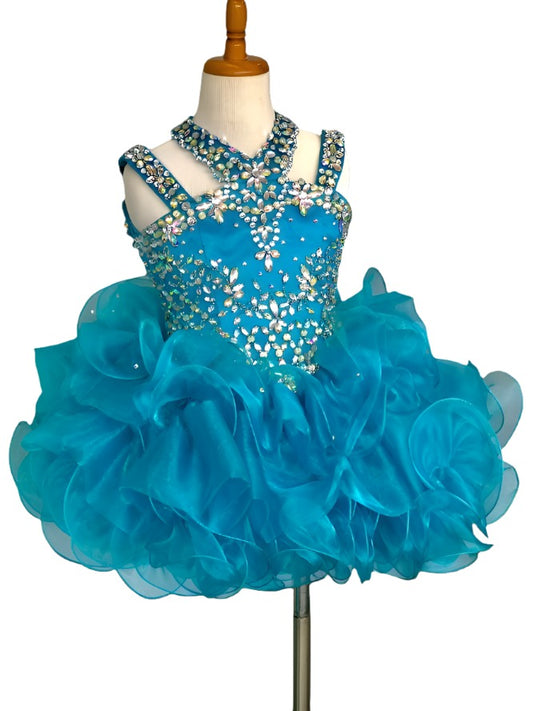 Ritzee Girls B279 is a short Layered ruffle cupcake Pageant Dress. Featuring a multi strap high neckline with AB Crystal Rhinestone Embellishments along the Top & Bodice. Open Cutout embellished back. Stunning stage gown!  Available Sizes:  2  Available Colors: Jade