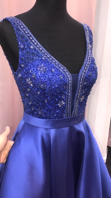 JVN67198 Royal Sizes 6  In Stock prom dress Beaded fitted bodice, plunging V neck with sheer mesh insert, sleeveless, V back, floor length a line pleated skirt, sweeping train evening gown. Pockets!!