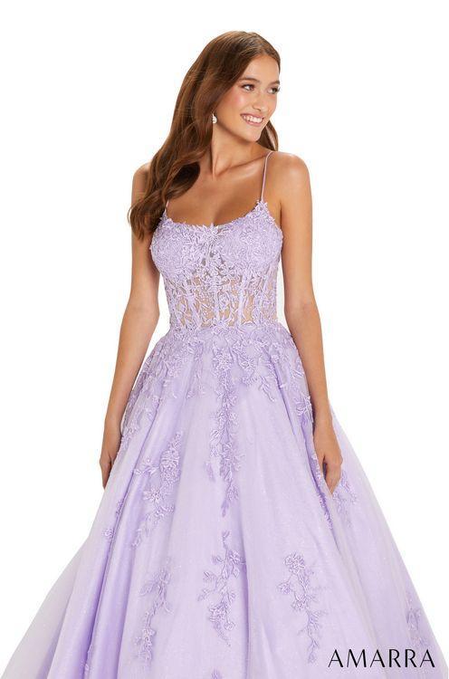 Amarra 88584 Long Shimmer Lace A Line Ballgown Prom Dress Sheer Corset Pageant Gown AMARRA 88584 is a breathtaking ball gown for an amazing prom experience. This design is elegant and chic with its tulle and lace embroidered pattern, sheer bodice, and corset-style lace-up back. It has shimmery rhinestones on the bodice to add some shine to your look and turn heads with every step.