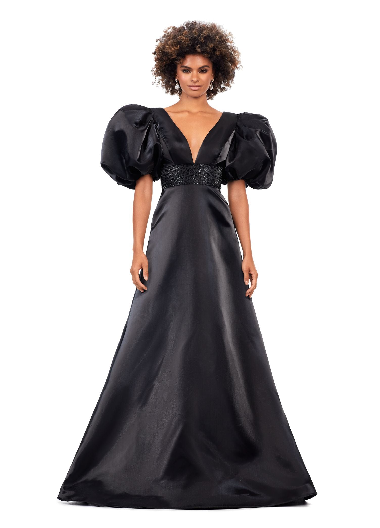 Ashley Lauren 11378 This elegant a-line gown features a heat set detailed waistband and oversized puff sleeves. With a v-neckline and v-back, this gown is the perfect mesh of elegant and fun! V-Neckline Oversized Puff Sleeves A-Line Skirt Shimmer Satin COLORS: Black, Red, White