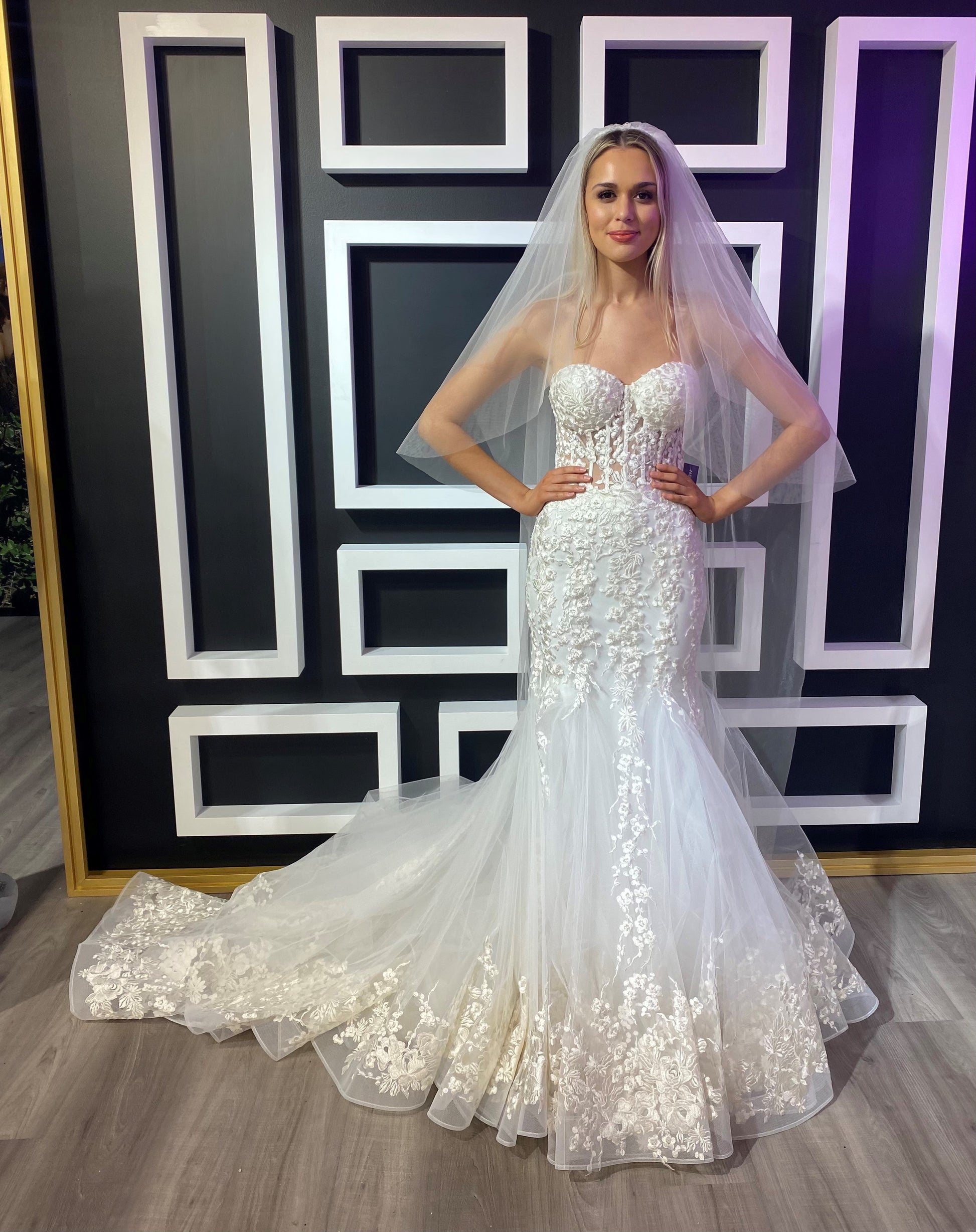 Jovani Bridal JB07260 Sheer Corset Lace Mermaid Wedding Dress Bridal Gown Train Strapless  This Jovani JB07260 off white wedding dress is styled in soft tulle with floral appliques, featuring a sheer corset bodice with a strapless sweetheart neckline. Lush godets form this trumpet-style bridal gown, finished with a lace border hemline and a semi-cathedral train.  Available Sizes: 00-24  Available Colors: Off White