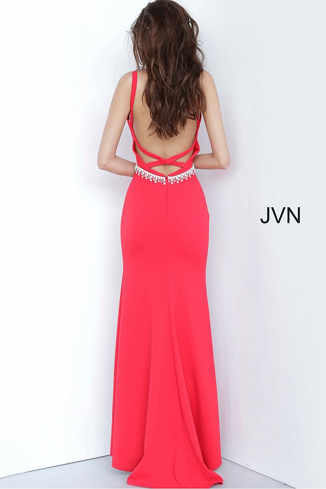 JVN by Jovani 02712 is a long Fitted Low Cut V neck Prom, Pageant & Formal evening wear dress. Long Fitted gown with an embellished tassel crystal waist belt. Open criss cross back.  Stunning classic gown. fitted bodice with slightly flared skirt featuring a slit.