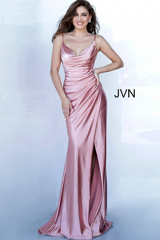 JVN 03104 is a long fitted satin prom dress with an asymmetrical ruched bodice and classy cowl neckline. High Thigh split with a small train in the back.