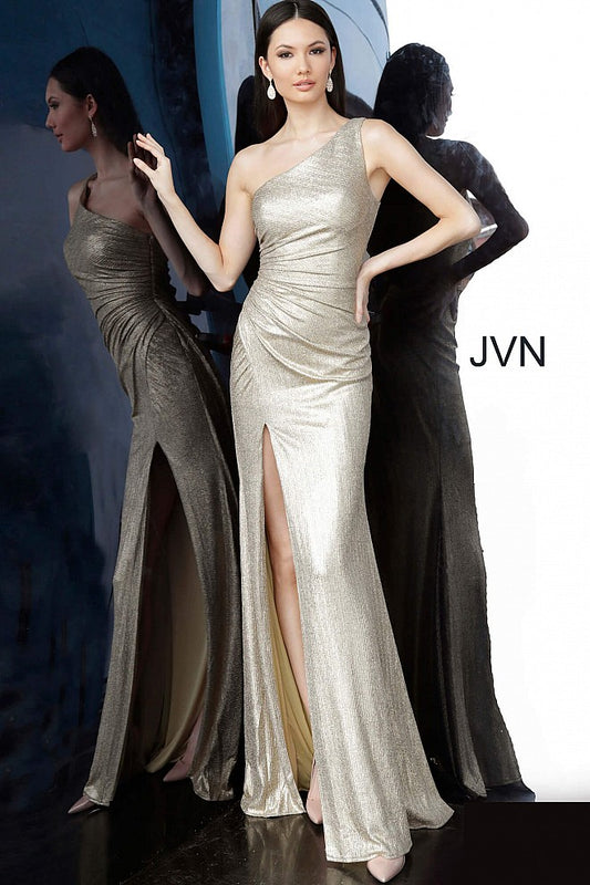 JVN 4734 is a Gold Long One shoulder Metallic Shimmer Prom Dress with a ruched bodice and slit in the skirt.