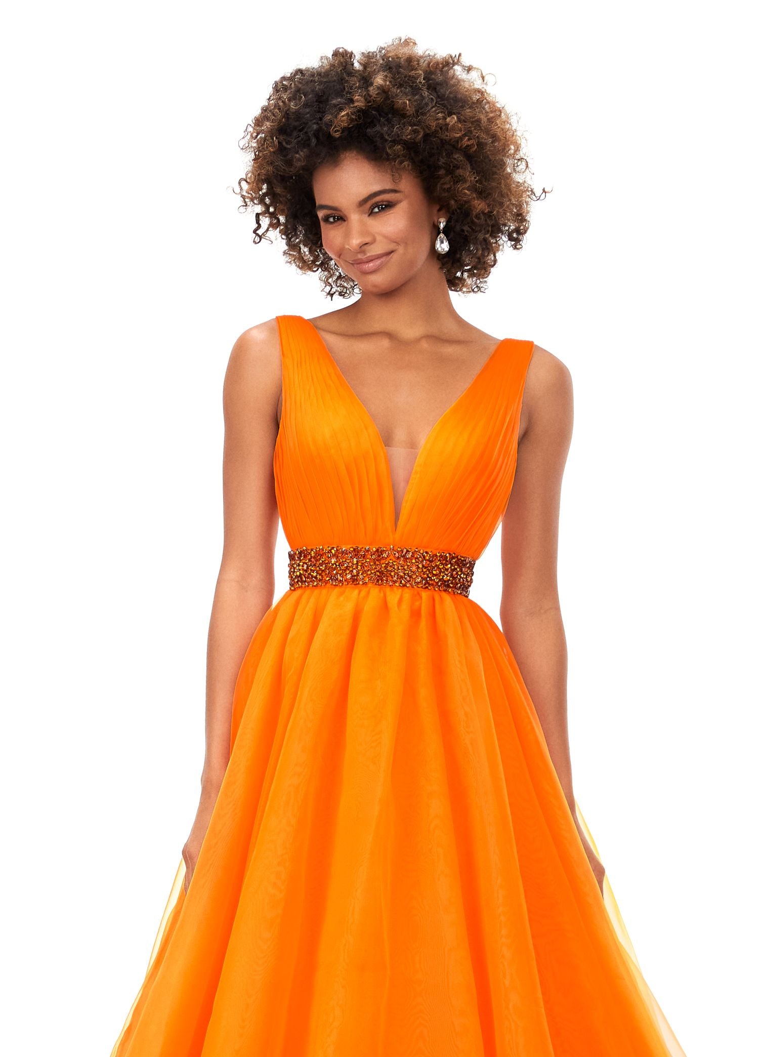 Ashley Lauren 11305 Stand out in this ball gown complete with a crystal encrusted waistband. The bustier has a deep v-neckline and a v-back. The gown is finished with a long, lavish train. V-Neckline V-Back Crystal Belt Organza COLORS: Orange, Royal, Red