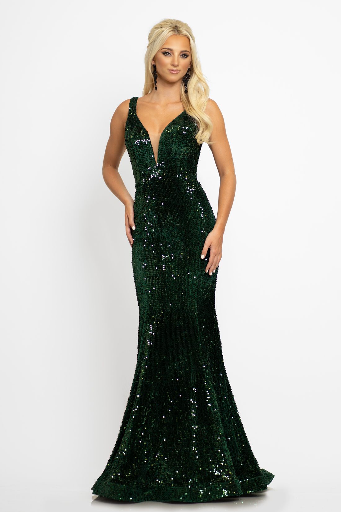 Johnathan Kayne 2237 This long prom dress has a plunging v neckline with mesh panel and a mid v back and is made of luxurious stretch velvet scattered with sequins.  The long mermaid skirt on this pageant gown has a sweeping train. Colors  Crimson, Emerald  Sizes  00, 0, 2, 4, 6, 8, 10, 12, 14, 16, 18, 20, 22