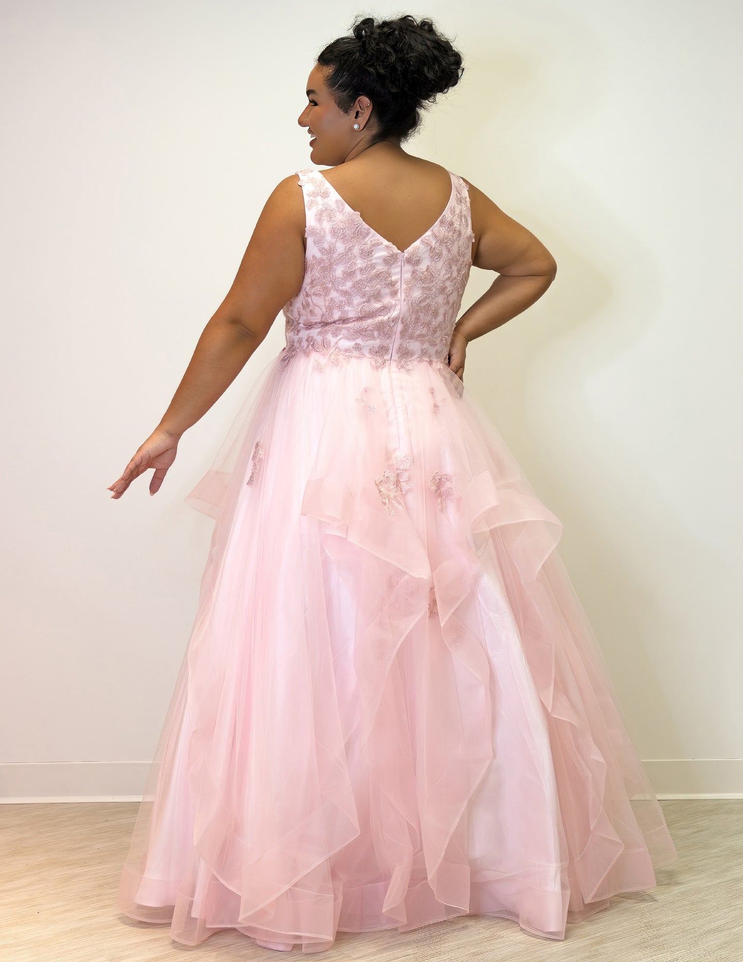 For a lasting impression at prom, the Sydney's Closet SC7347 Floral Lace Bodice dress offers timeless elegance with its layered tulle ballgown skirt and tonal mesh insert. The V-neckline and bra-friendly straps deliver a flattering fit, while the natural waistline and horsehair hem ensure a stylish finish.