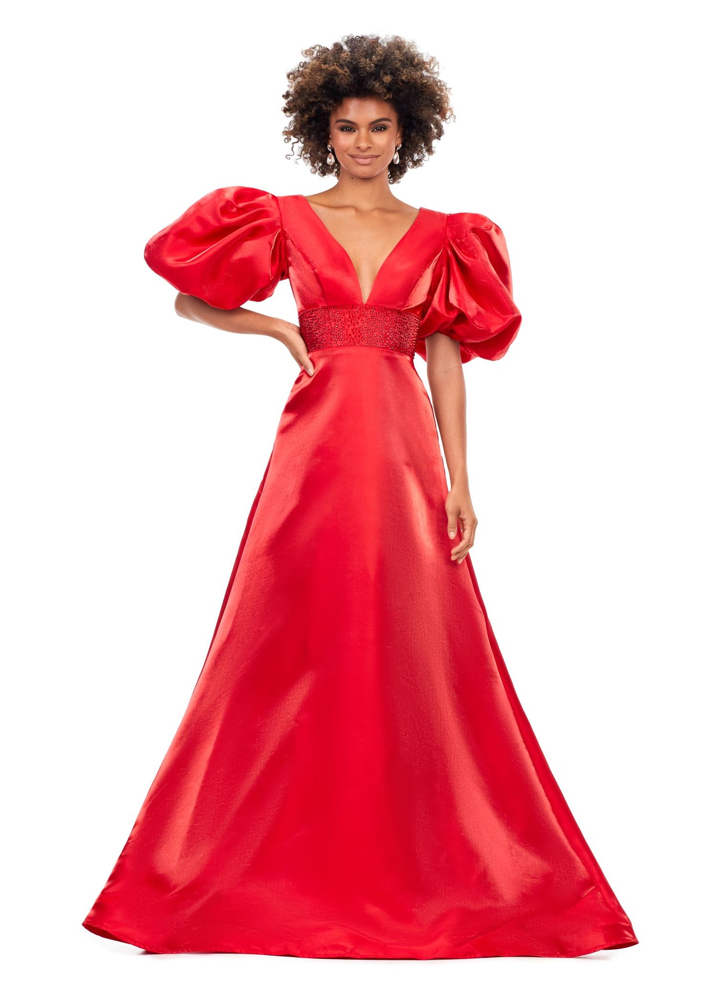 Ashley Lauren 11378 This elegant a-line gown features a heat set detailed waistband and oversized puff sleeves. With a v-neckline and v-back, this gown is the perfect mesh of elegant and fun! V-Neckline Oversized Puff Sleeves A-Line Skirt Shimmer Satin COLORS: Black, Red, White