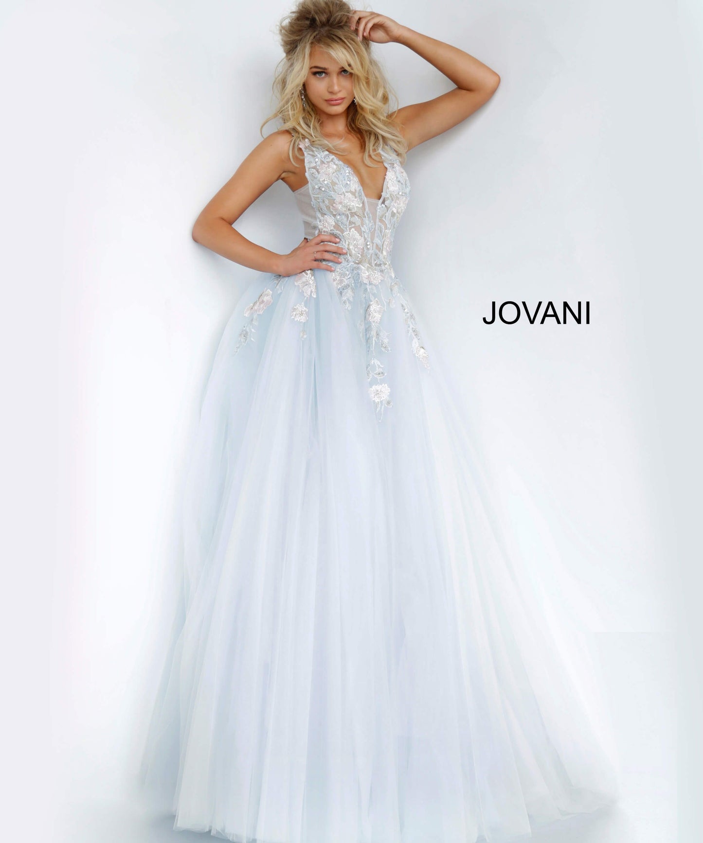 Jovani 11092 floral embellished plunging neckline tulle prom dress ball gown evening dress. Long Sheer floral lace applique embellished formal ball gown evening. Prom Dress, Pageant Gown.  Light blue tulle prom ballgown with floral embroidered bodice featuring a sheer sleeveless bodice, plunging neckline and low v-shaped back with zipper, floor-length A-line skirt. Available colors:  Blush, Light Blue